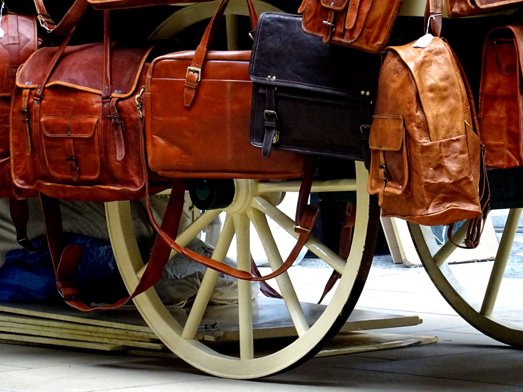 two brown and black leather handbags